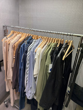 Curated rack of vintage clothing