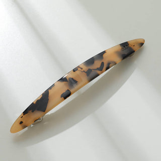 Lighter tortoiseshell French barrette with tan and black cloudy pattern detail
