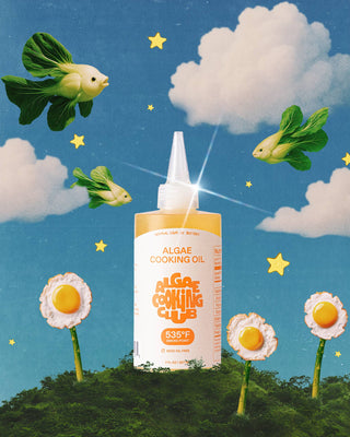 Algae Cooking Oil bottle in whimsical scene with flying bok choy fish, fried egg flowers, fluffy clouds and yellow stars on blue sky background