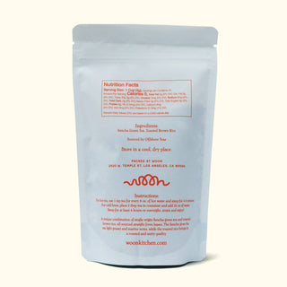Back of Woon Genmaicha tea package showing nutrition facts, ingredients list, brewing instructions, and Woon Kitchen Los Angeles address