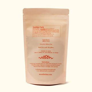 Back of Woon Hibiscus tea package showing nutrition facts, ingredients list stating hibiscus petals, brewing instructions, and Los Angeles packing address