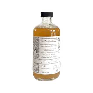 Back label of MOTHER shrub Ginger bottle showing product description, ingredients list including organic apple cider vinegar and ginger
