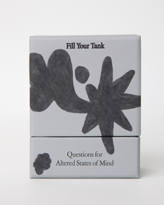 White card deck box with abstract black organic shapes and text reading 'Fill Your Tank' and 'Questions for Altered States of Mind'