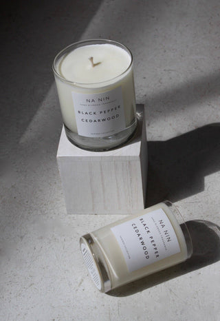 Candles in two sizes on neutral background