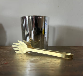 Candle snuffer in front of candle