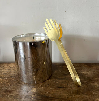 Candle snuffer resting on candle