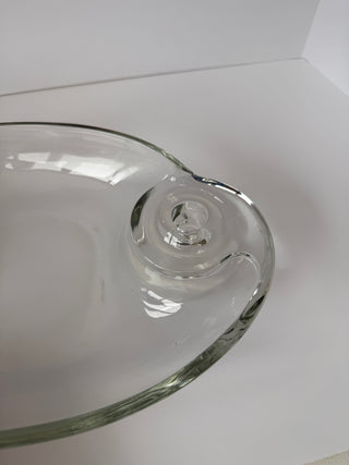 Close-up detail of vintage clear glass centerpiece showing spiral candle holder design on oval dish