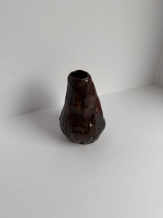 Top view of vintage aubergine ceramic vase showing open mouth and irregular organic shape with lustrous dark purple-brown glaze
