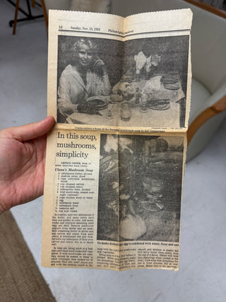 Vintage newspaper clipping from Philadelphia Inquirer November 13 1983 tucked inside cookbook featuring Ulana's Mushroom Soup recipe with black and white photo