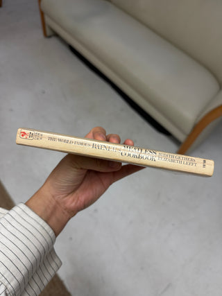 Spine view of vintage Ratner's Meatless Cookbook by Judith Gethers and Elizabeth Lefft showing wear and age patina