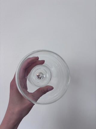 Top-down view of vintage glass goblet showing circular bowl opening and concentric rings with visible stem center