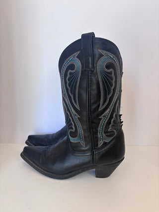 Side profile of single vintage black leather Western boot showing full height and stitching detail