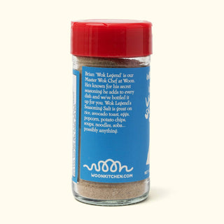 Back panel of Woon Wok Legend's Seasoning Salt jar showing product description and usage suggestions