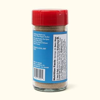 Side view of Woon Wok Legend's Seasoning Salt jar displaying ingredients list and nutrition facts with barcode
