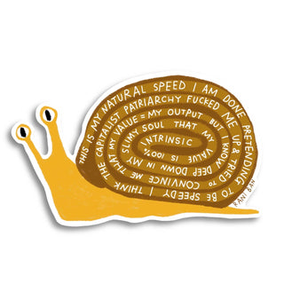 Yellow and brown vinyl snail sticker with motivational text on white background showing die-cut shape and eyestalk details