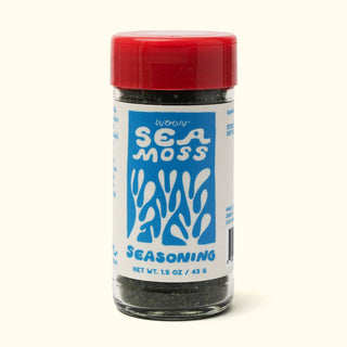 Woon Sea Moss Seasoning jar front view showing blue and white label with seaweed graphic and red cap on beige background