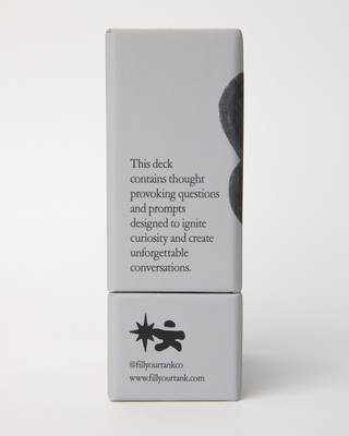 Side panel of card deck displaying text 'This deck contains thought provoking questions and prompts designed to ignite curiosity and create unforgettable conversations' with Fill Your Tank logo